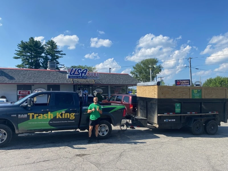 Tyler Farmer with the Trash King truck in Salem, NH