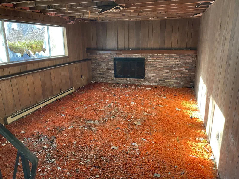 Room with fireplace during debris removal